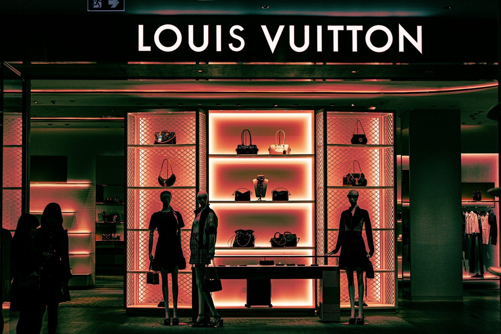 Louis vuitton store with mannequins and handbags