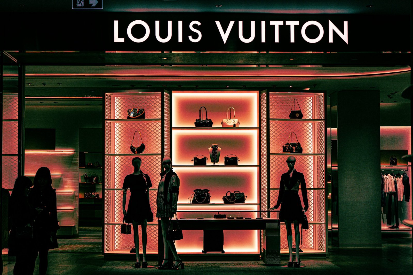 Louis vuitton store with mannequins and handbags